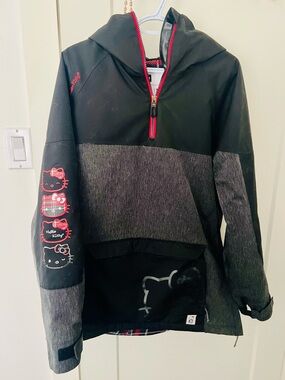 686 Black & Gray Hello Kitty Half-Zip snowboard/ski jacket with red Accents